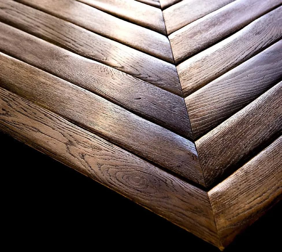 Wide antique oak plank flooring in a refined interior