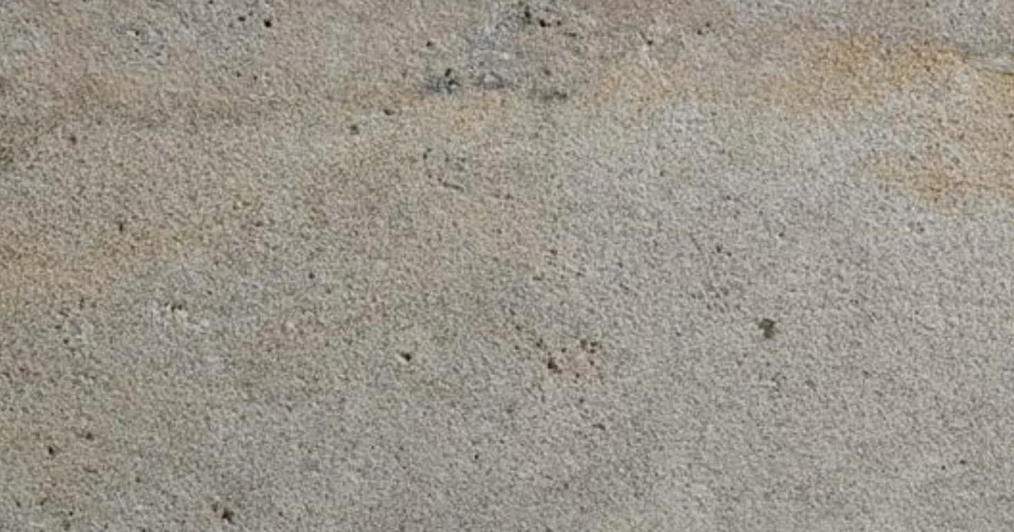 Mahogany travertine, bush-hammered