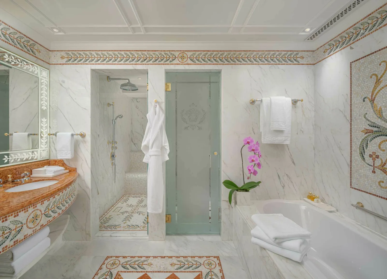 Marble bathroom with classical mosaic borders