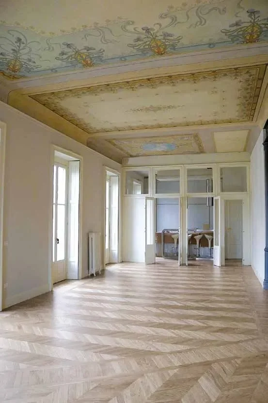 Room with a wide-plank hardwood floor