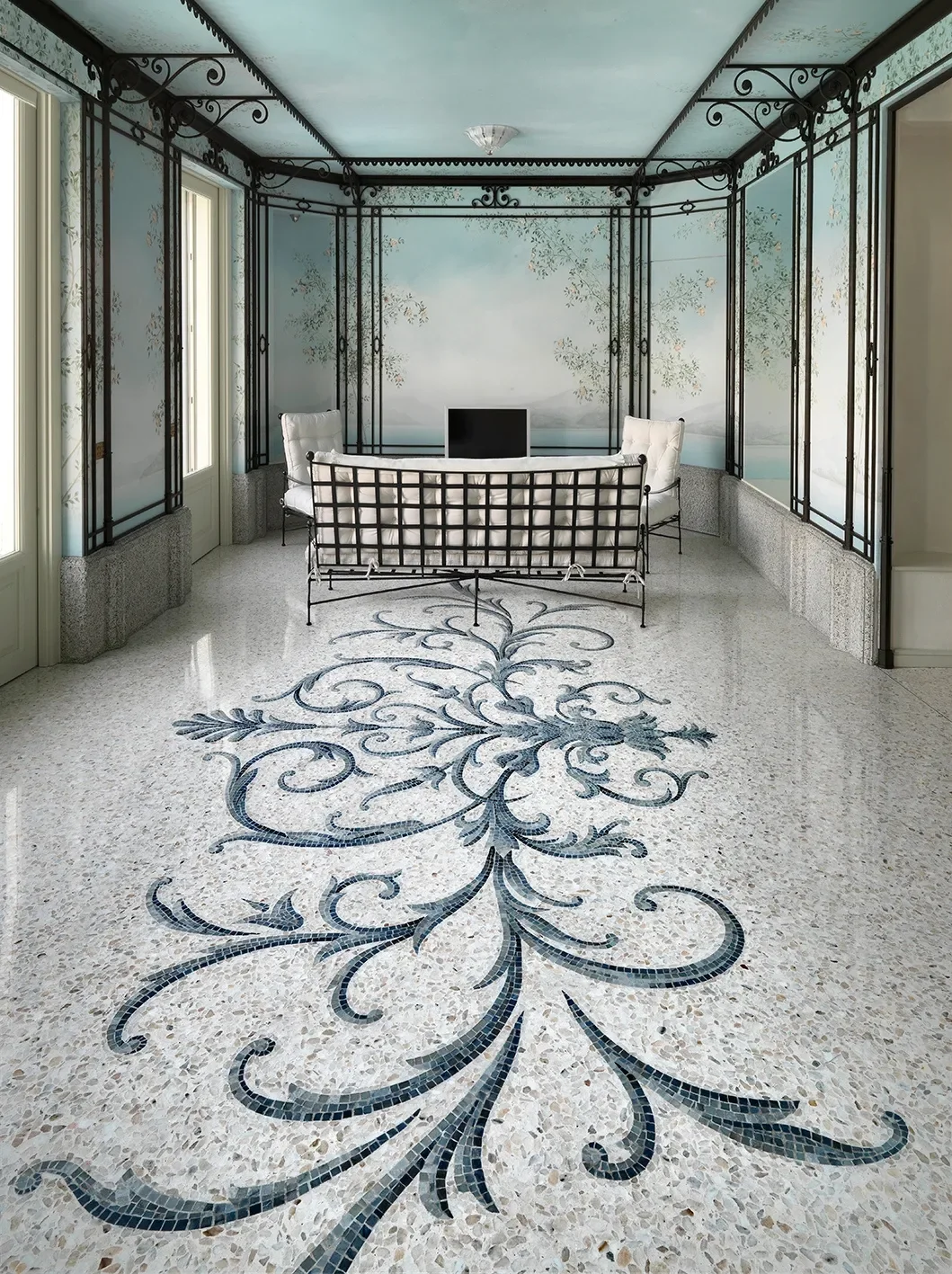 Lobby with an ornamental mosaic floor medallion