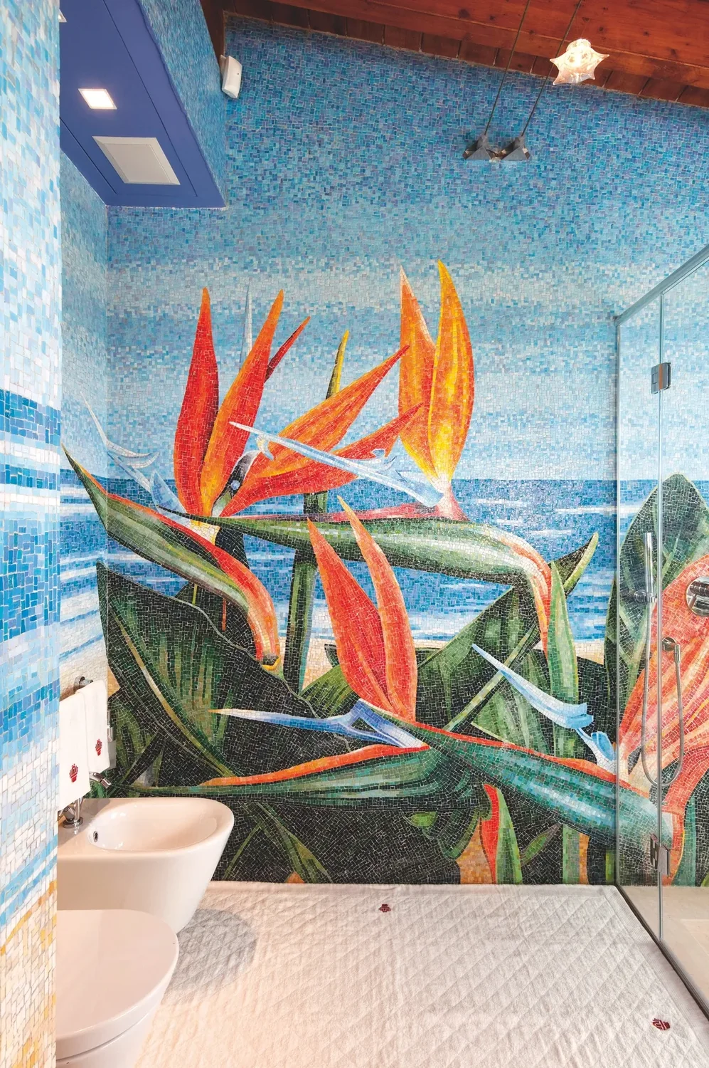 Bathroom with a tropical mosaic mural