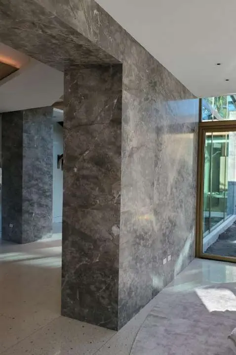 Grey stone portal framing the passage between interior spaces
