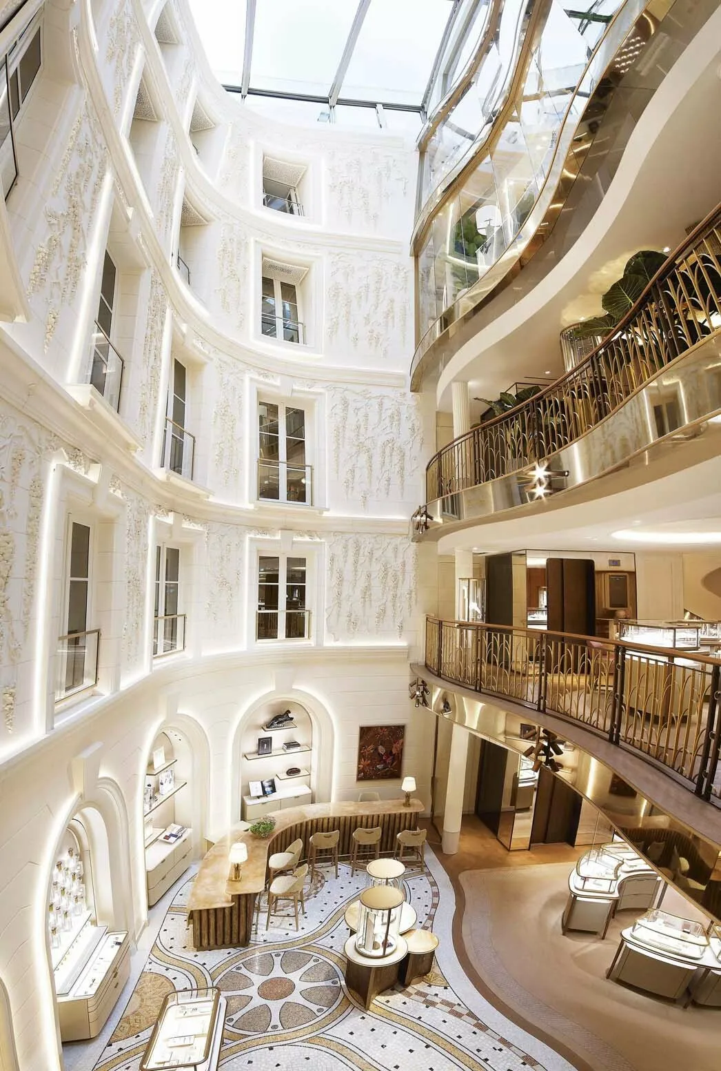Multi-level Cartier flagship boutique atrium in Paris with an artistic mosaic floor