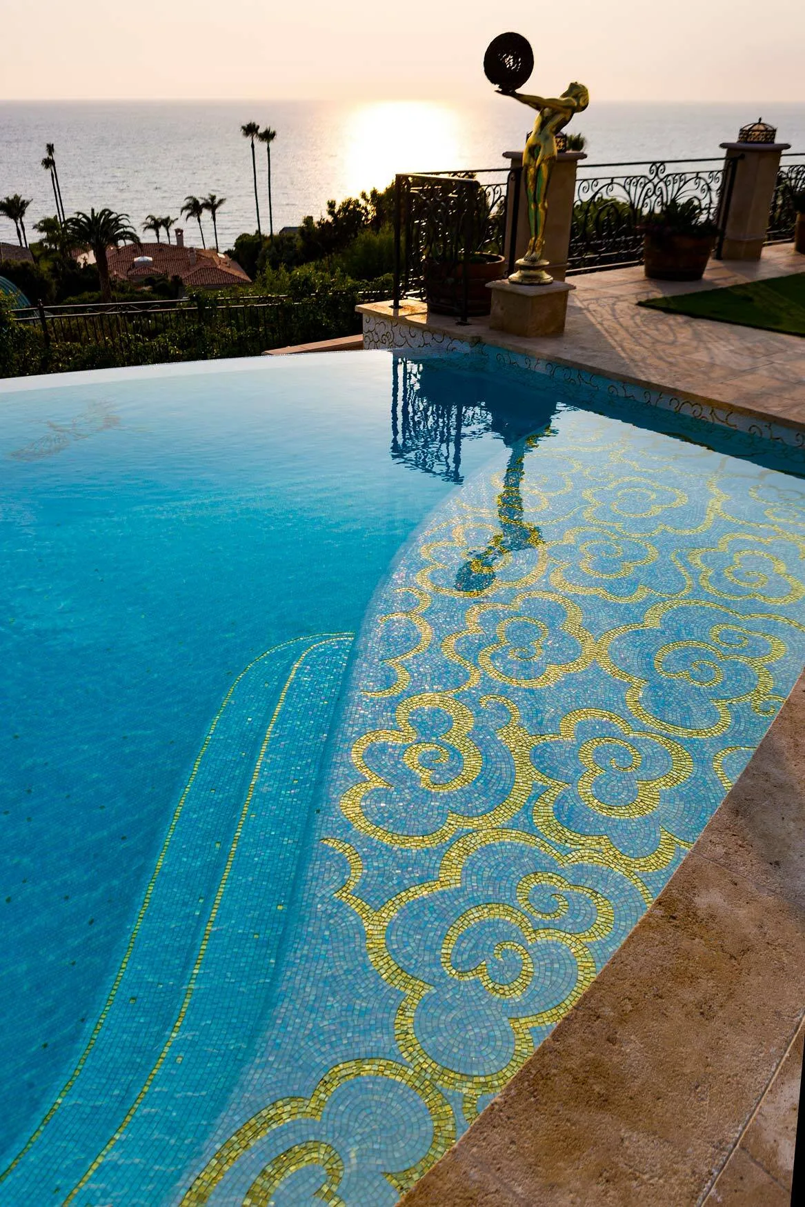 Gold and white mosaic pattern in the pool water