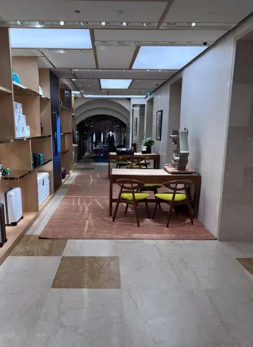 Corridor with a beige and white checkerboard marble floor
