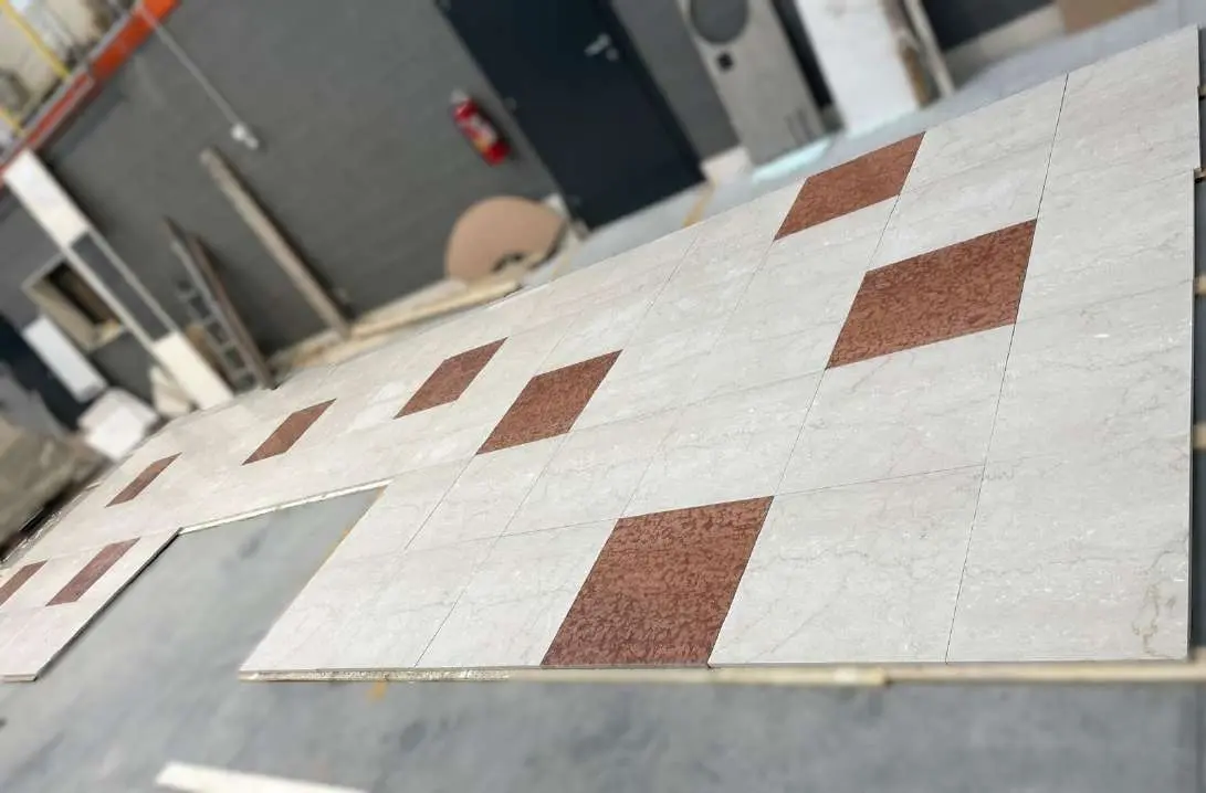 Dry-laid marble floor with red marble inserts