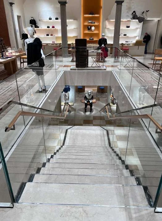 Marble staircase with a glass balustrade