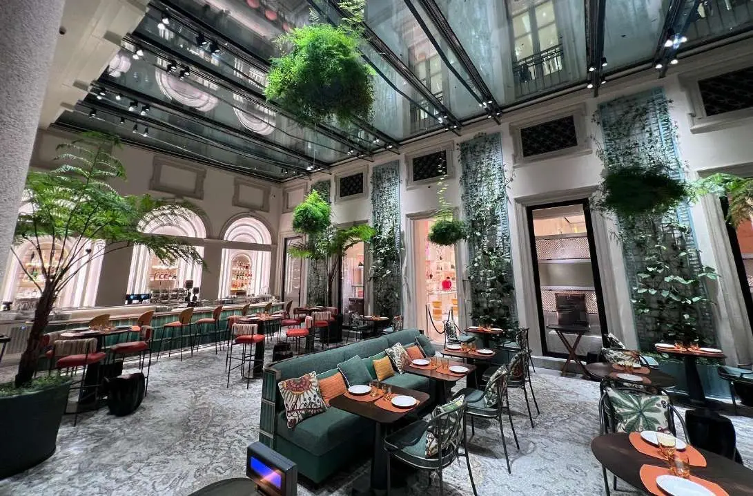 Wide view of the courtyard restaurant with mosaic flooring