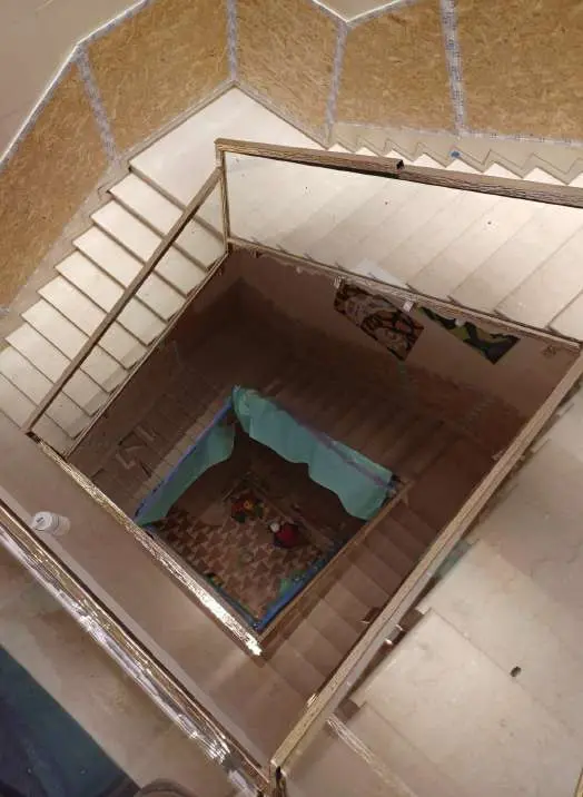 Staircase landing with a mosaic inset