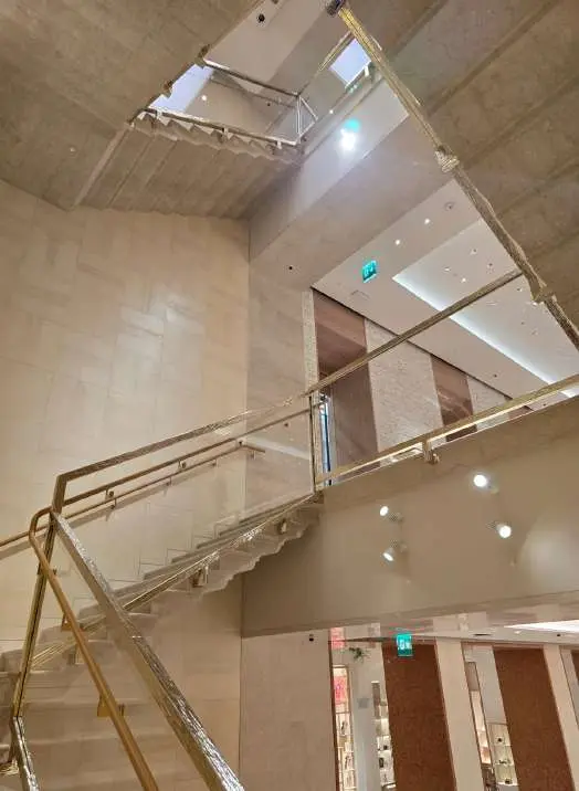 Marble staircase seen from above winding between floors