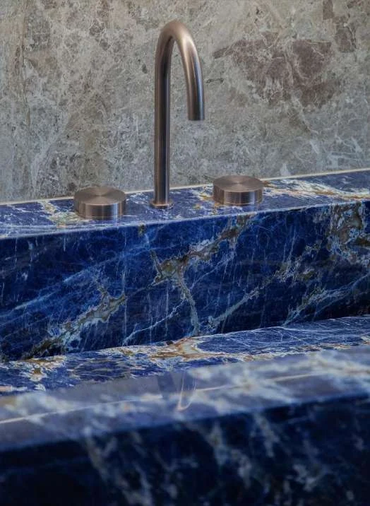 Blue Lapislazuli basin with a wall-mounted faucet