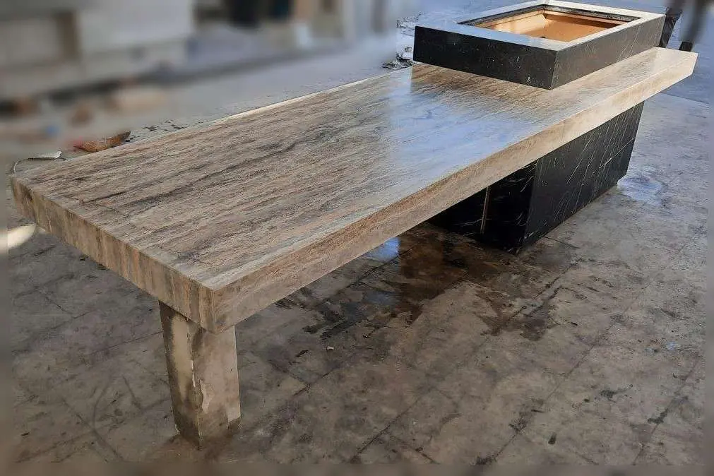 Travertine bench built on trestles in the workshop
