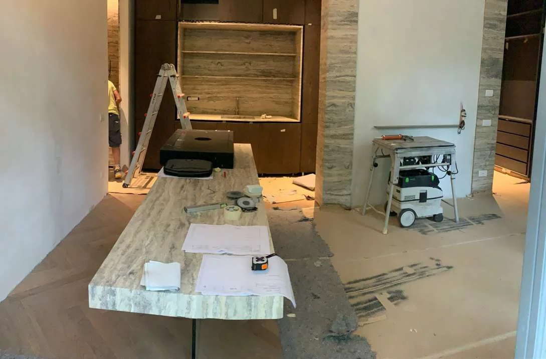Travertine counter installed on site with tools nearby