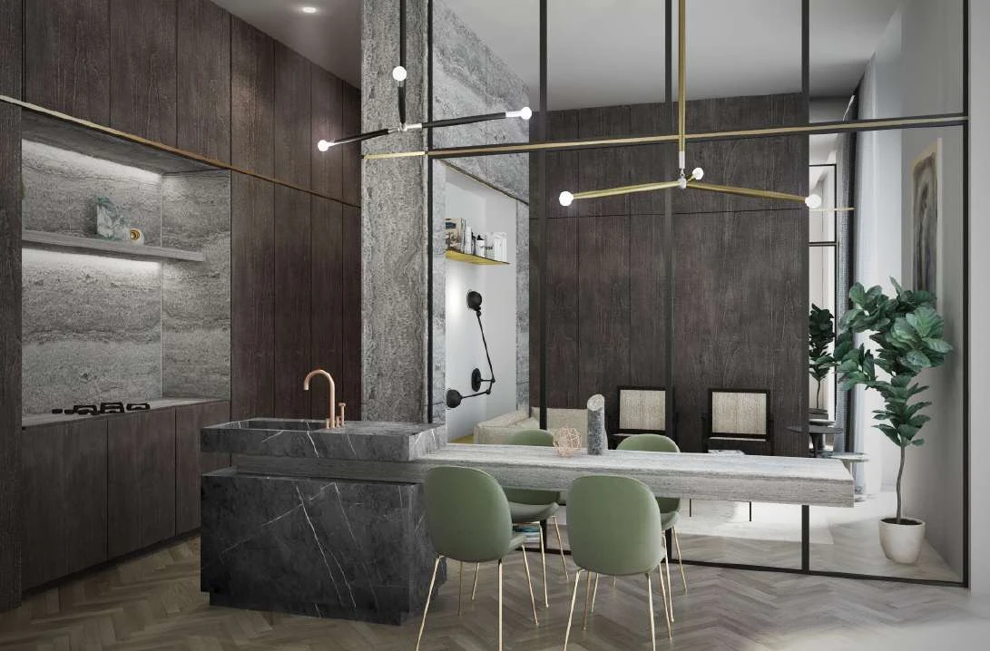 Kitchen with a Travertino Silver island counter, dark cabinetry and brass fixtures