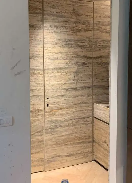 Travertine shower with a recessed niche