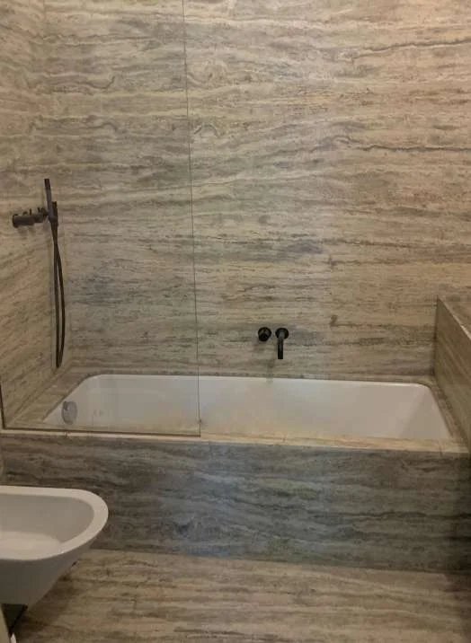 Travertine tub surround with matching wall panels
