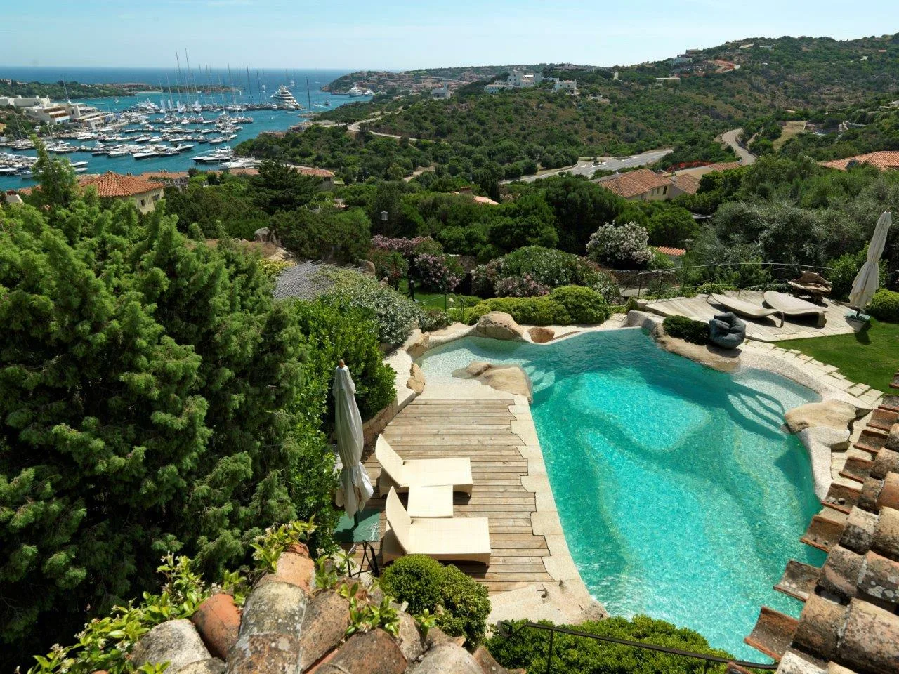 Infinity mosaic pool overlooking the Porto Cervo marina in Sardinia