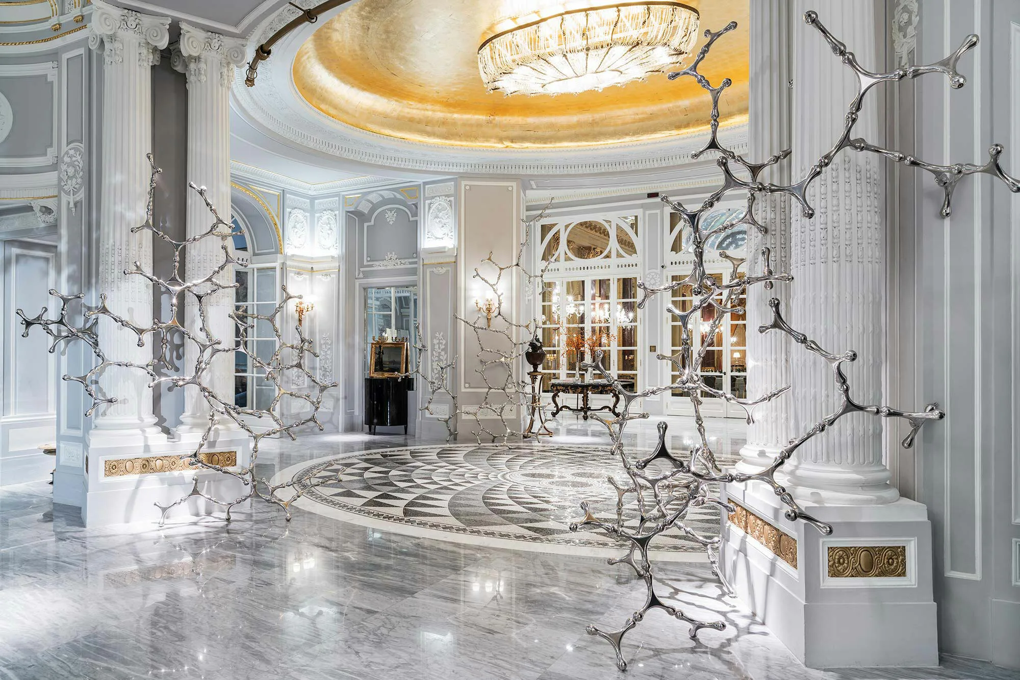 St. Regis Rome rotunda with a black and white marble mosaic floor under a gilded dome