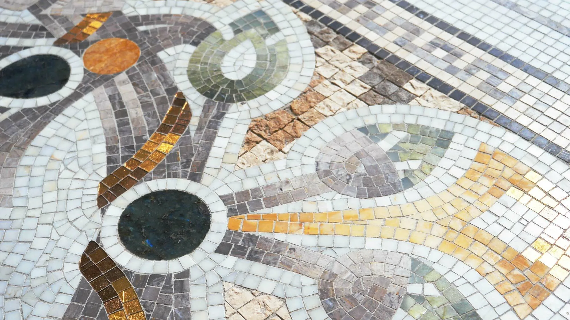 Patterned mosaic deck around the Sarasota pool