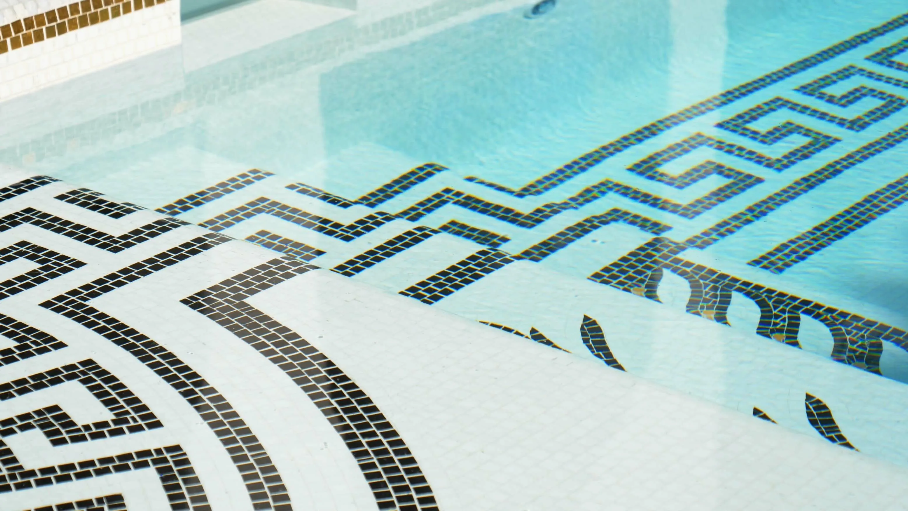 Mosaic paving surrounding the swimming pool