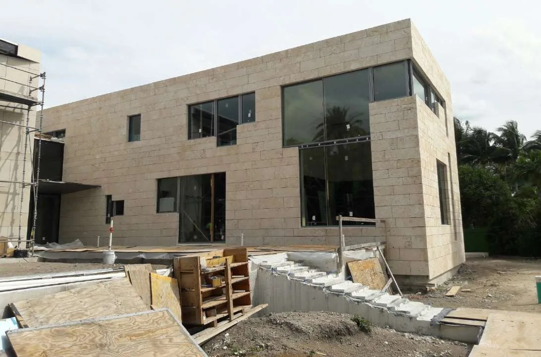 Coquina cladding installation in progress