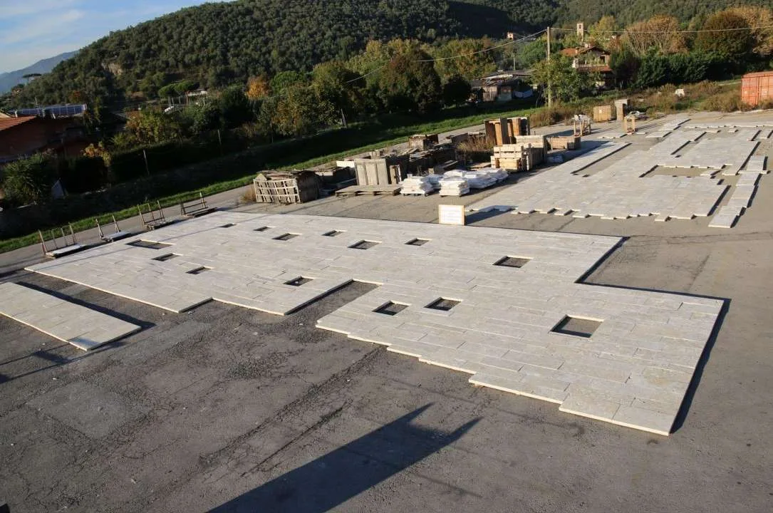 Aerial view of the full facade dry-laid on the ground in Italy