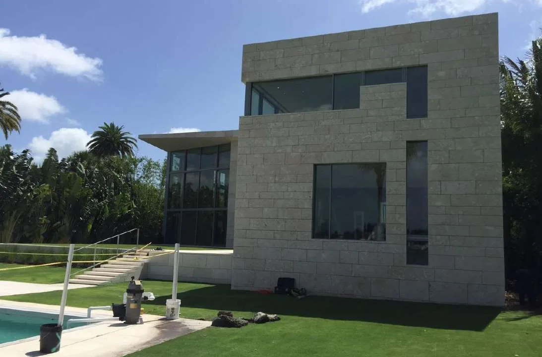 Pool-side view of the coquina-clad villa