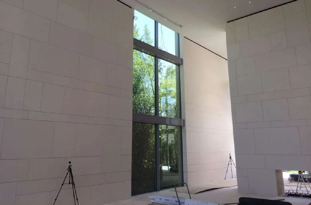 Double-height interior with stone surfaces