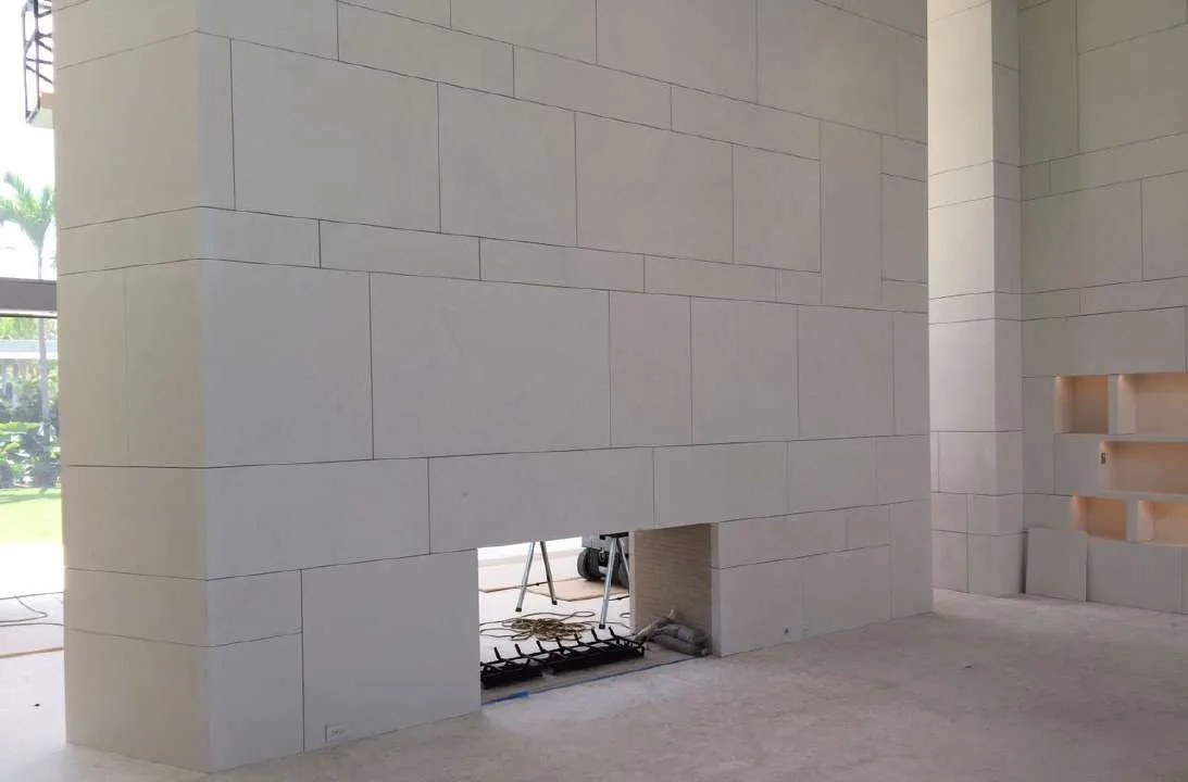 White stone clad interior wall