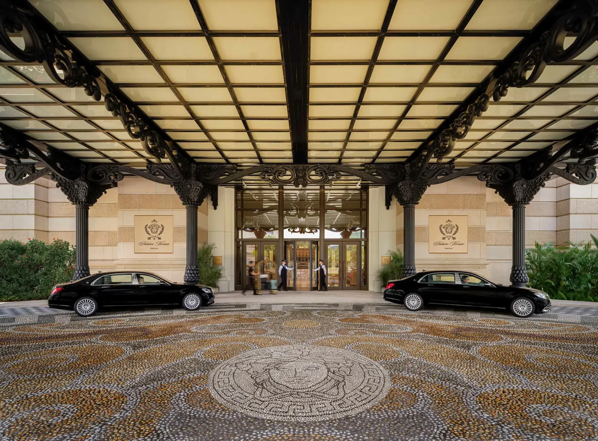 Hotel entrance with an ornate marble mosaic floor