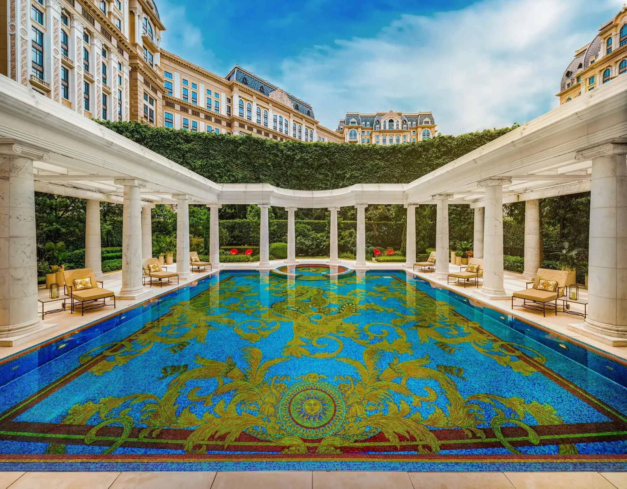 Outdoor pool deck with mosaic surfaces at Palazzo Versace Macau