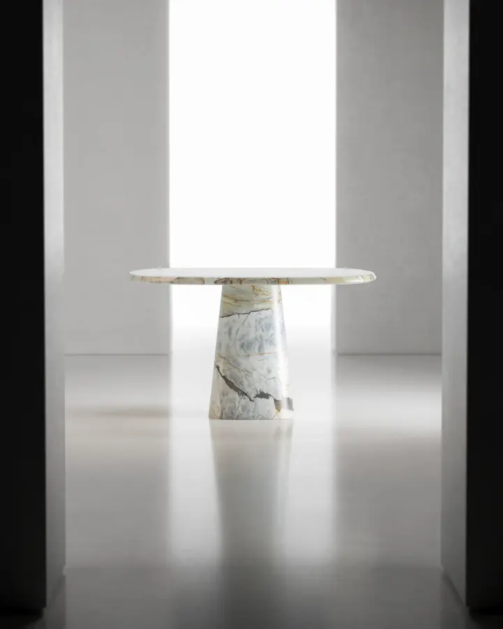 Wedge marble dining table in Calacatta Macchia Vecchia